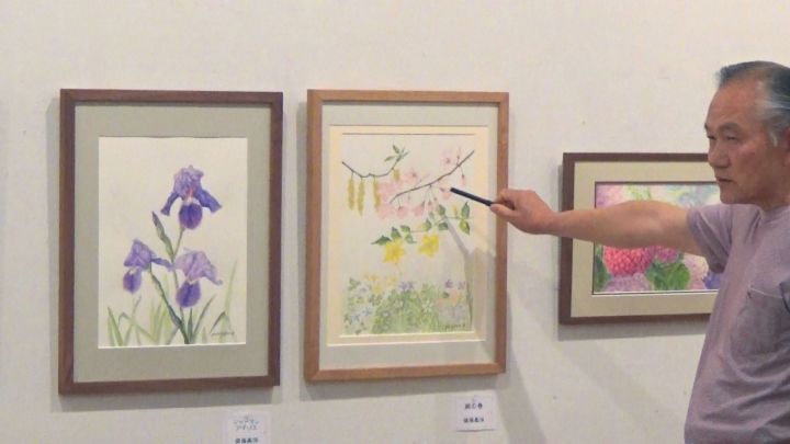 交流会で自作を語る齋藤会員